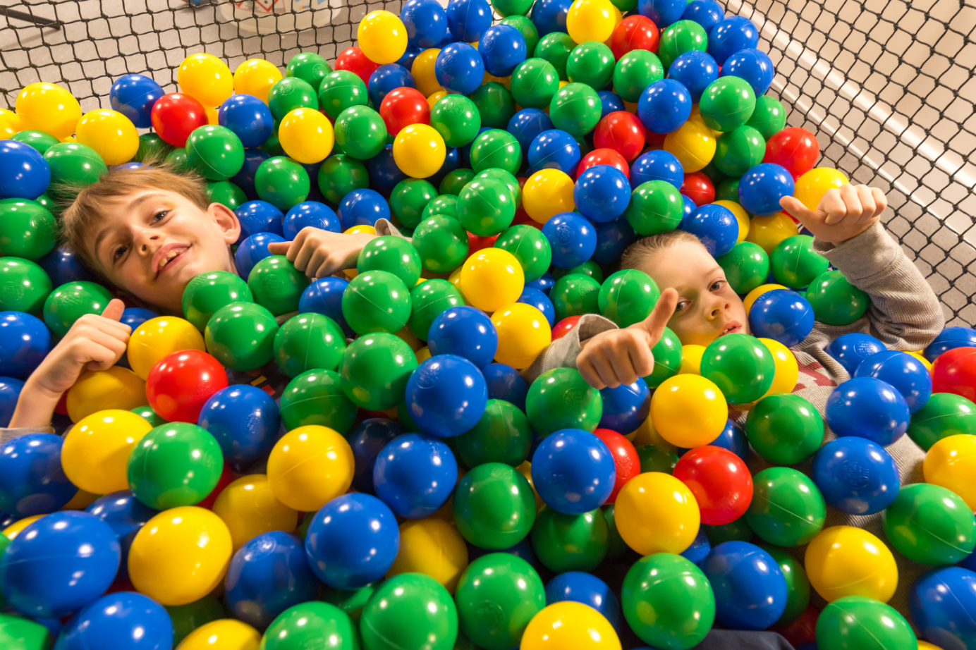 Children playing in a ball pool at Leo's Funzone