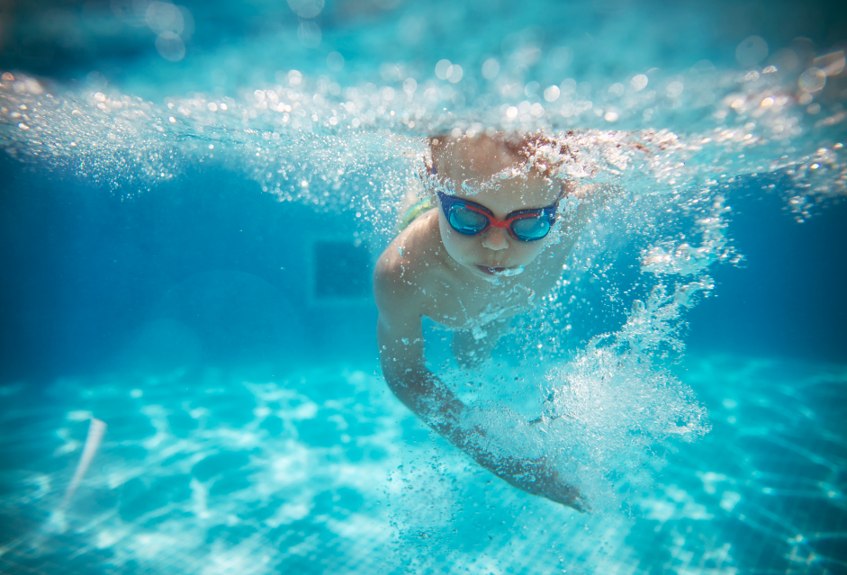 boy swimming underwater