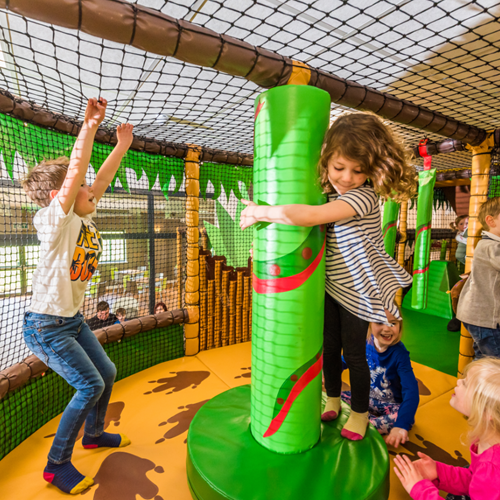 Children playing on spinner in Leo's Funzone